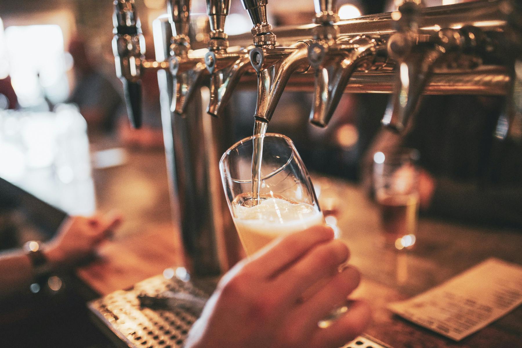 Photographer Pouring a Pangaea draft beer in a glass