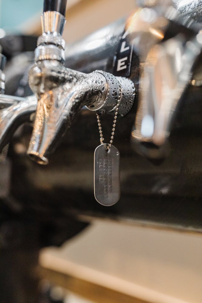 Beer tap adorned with military dog tag