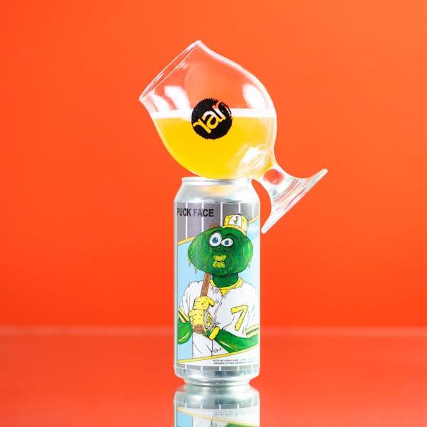 Puckface_190815 16 oz. can of RaR beer with glass balanced on top