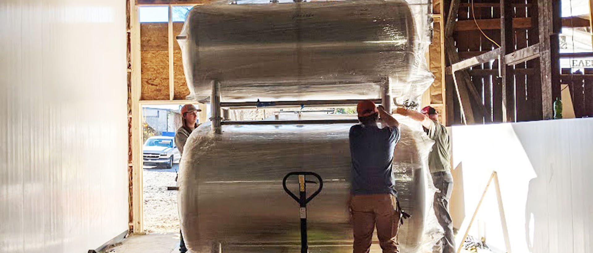 Loading new tanks in the brewery