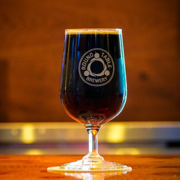 ORG_DSC06398 A dark stout beer in a Round Table Brewery glass.