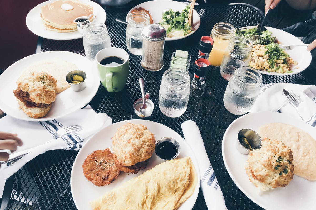5 plates of brunch style food on a table