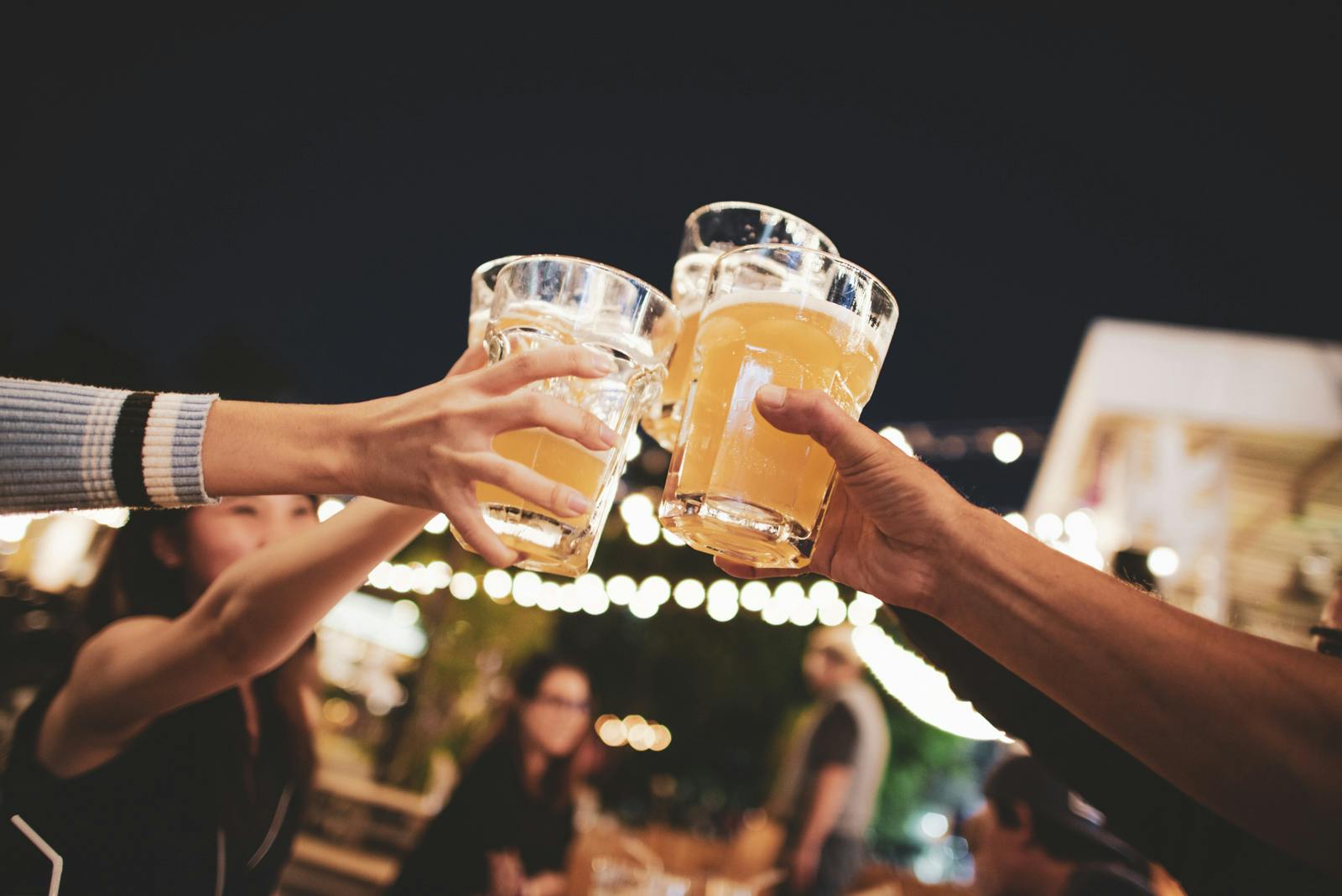 SAVA-AdobeStock_159536291 Friends raising glasses of beer