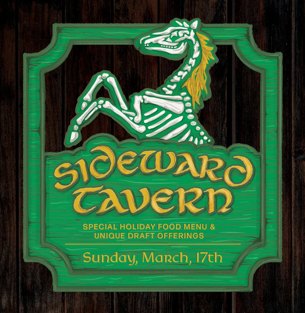 A green sign on a wooden background that reads "Sideward Tavern: Special Holiday Food Menu & Unique Draft Offerings. March 17th"