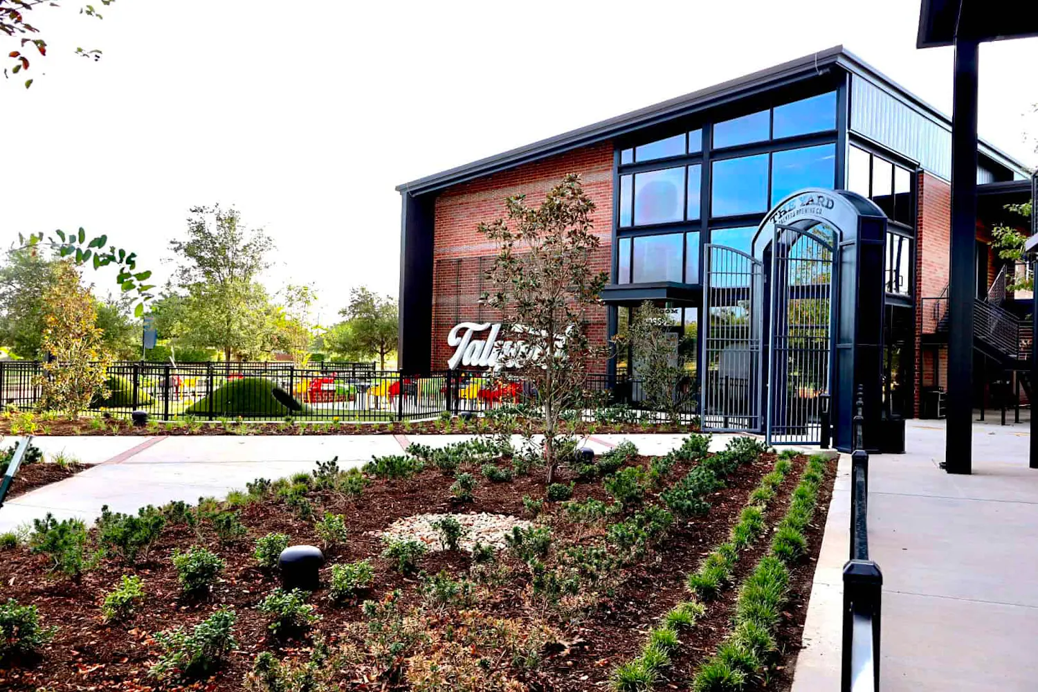 The entrance and landscaped grounds at Talyard Brewing Company in Sugar Land