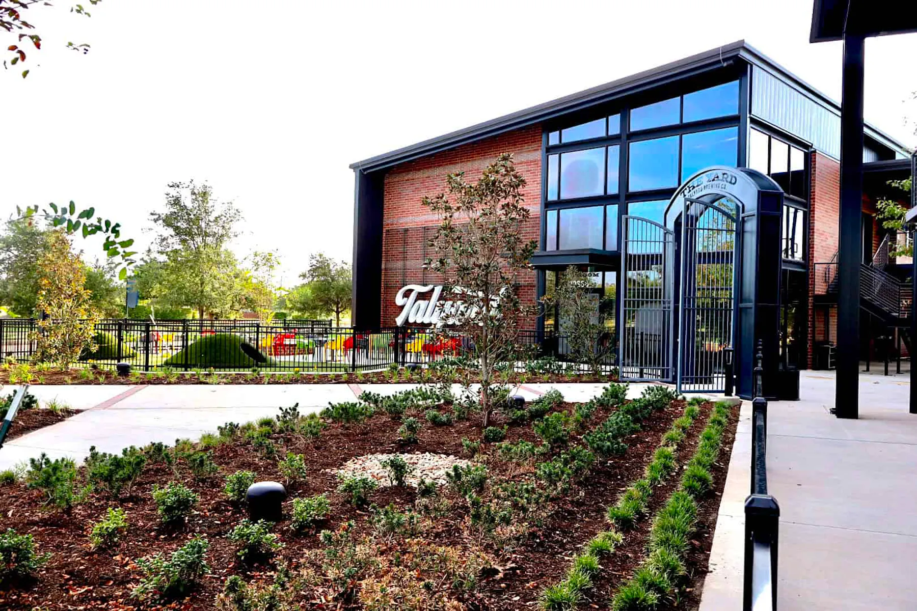 The entrance and landscaped grounds at Talyard Brewing Company in Sugar Land
