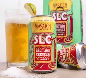 Salt Lime Cerveza can in front of Crushed can, box, and glass of beer