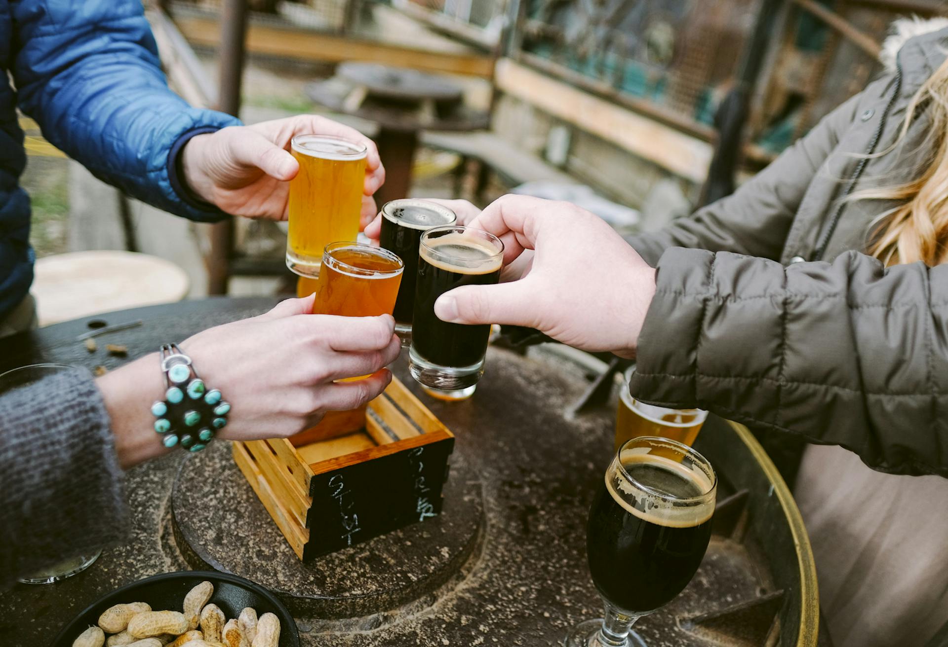 Four people share a flight of Wedge beers